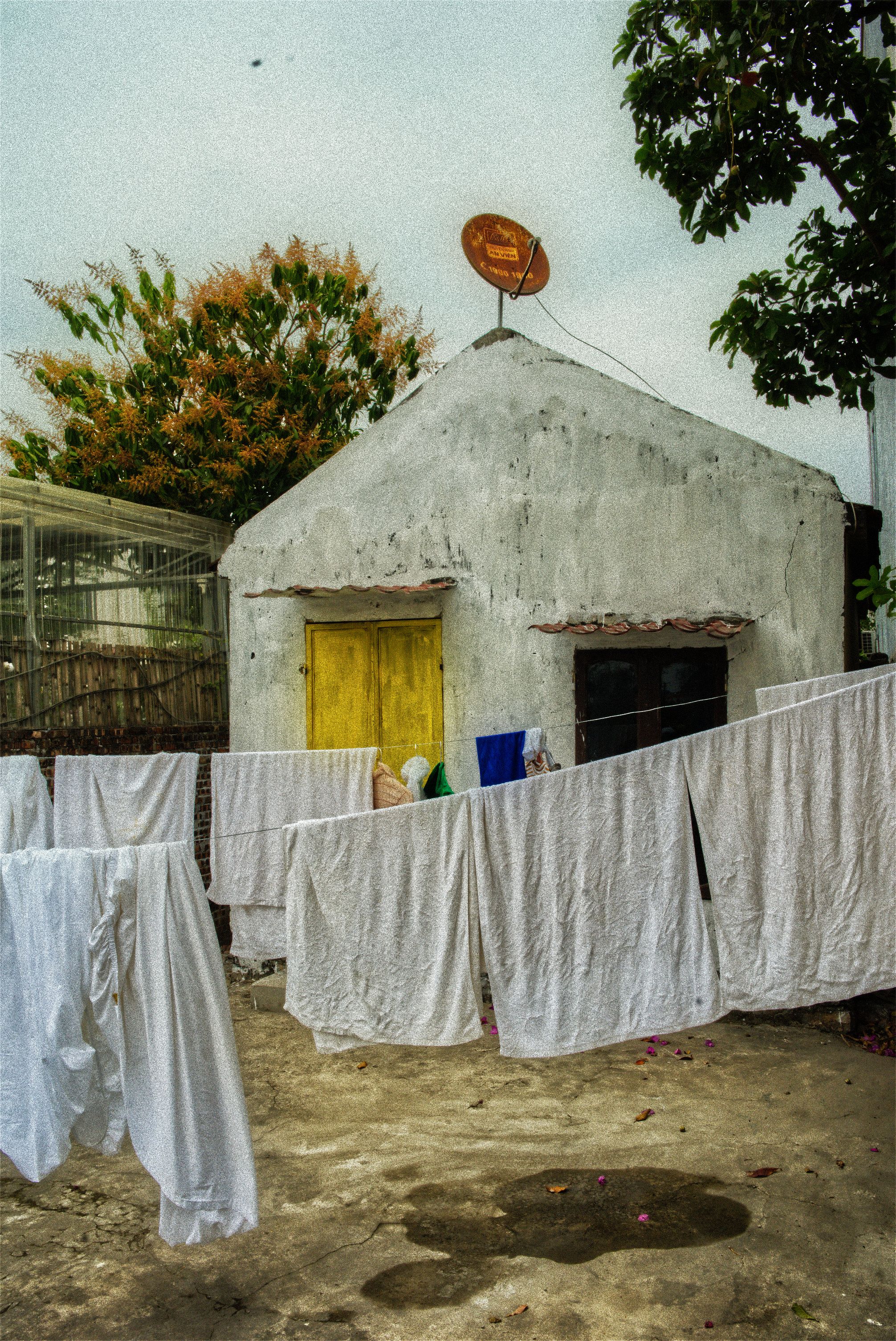 Vietnam — laundry line and yellow door